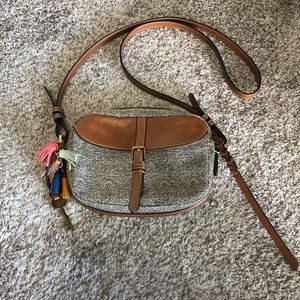 Fossil small bag with key and tassels.